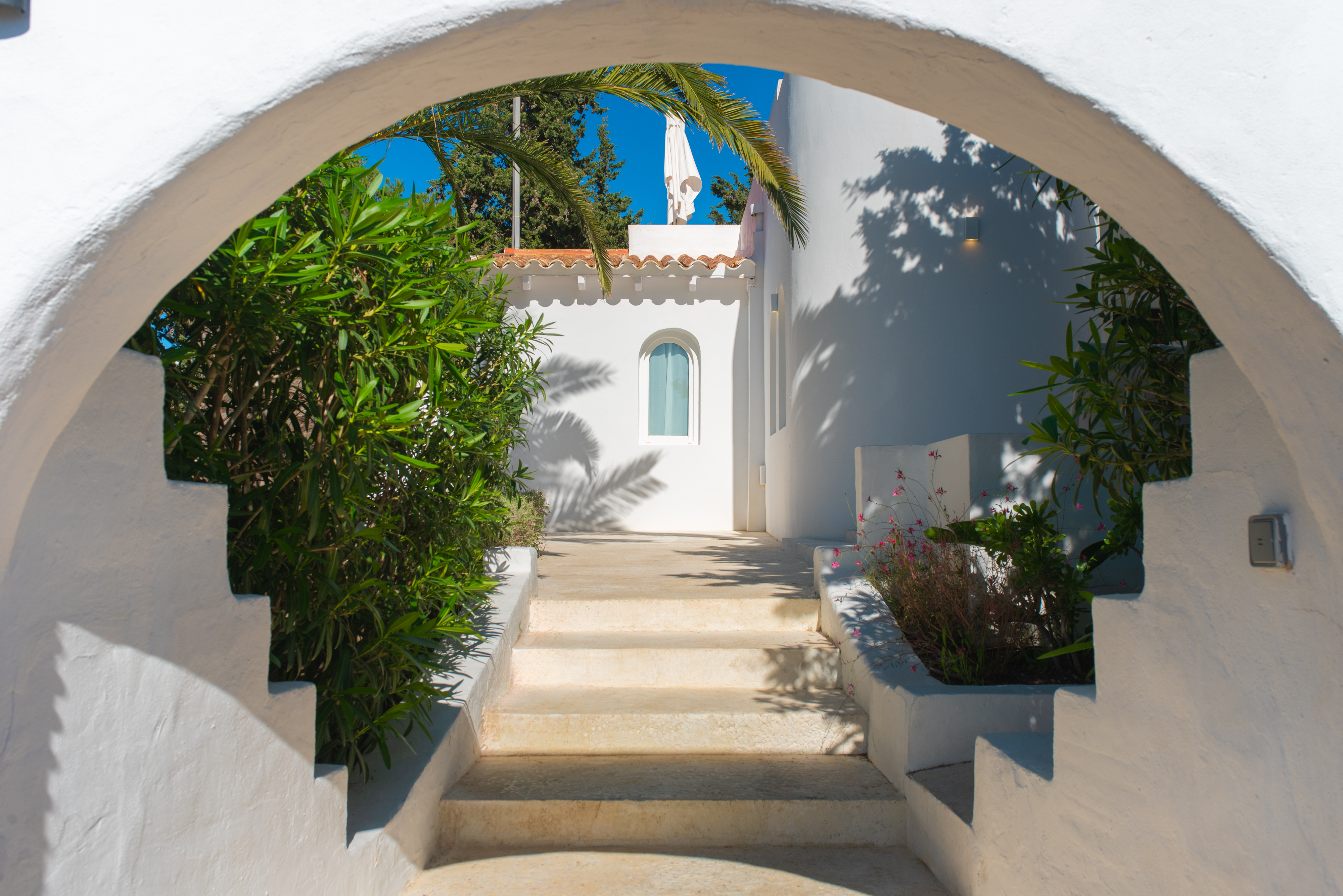 White arched entrance — iconic Ibiza architectural detail